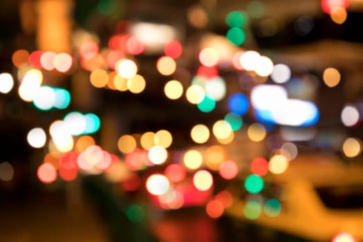 Blurry background image of defocused colorful abstract city street lights at night