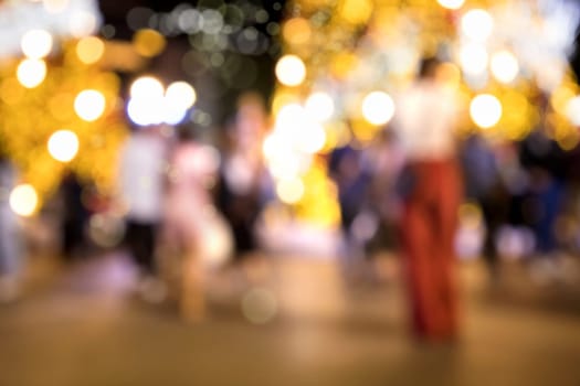 Conceptual abstract background image of defocused Christmas decoration on city street at night