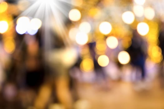 Conceptual abstract background image of defocused Christmas decoration on city street at night