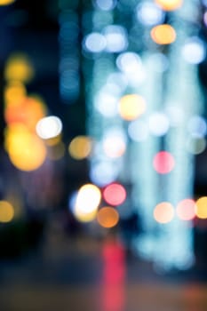 Blurry background image of defocused colorful abstract city street lights at night