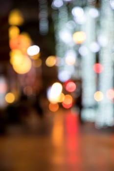 Blurry background image of defocused colorful abstract city street lights at night