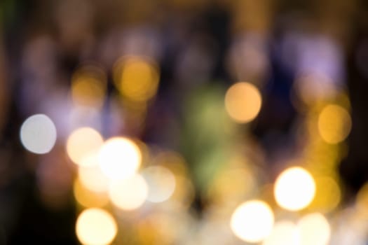 Blurry background image of defocused colorful abstract city street lights at night