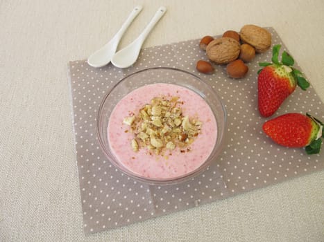 Homemade breakfast cottage cheese with strawberries and nuts