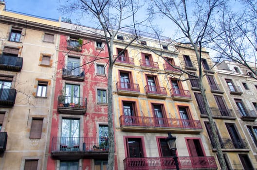 Colorful buildings with paintings in the center of Barcelona, Spain