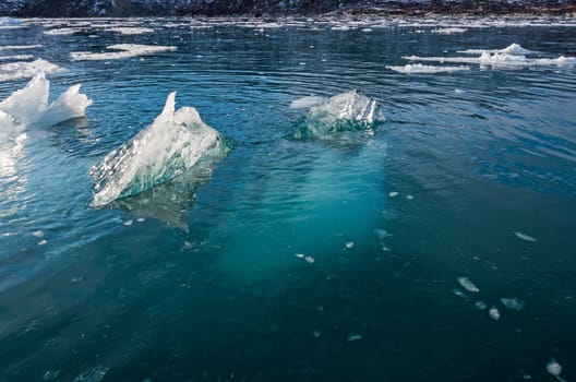 Most of the Iceberg is Underwater near the Eqip Glacier in Western Greenland