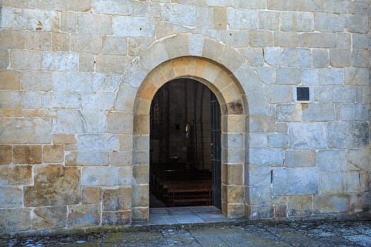 Romanesque perfect arch at the entrance to the Cistercian Church of Santa Maria de Aguiar, built in the 12th century near the historic village of Castelo Rodrigo, Portugal