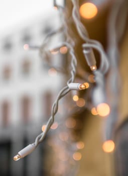 Street Christmas lights on blurred background.