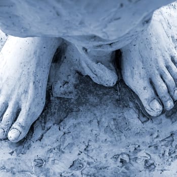 Cose-up of the feet of Jesus Christ. Top view. Shallow depth of field.