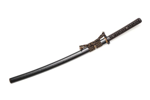 Brown leather cord tie on grip Japanese sword and black scabbard with steel fitting isolated in white background.