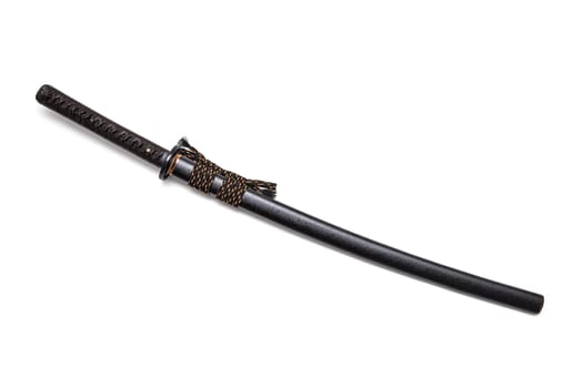 Brown leather cord tie on grip Japanese sword and black scabbard with steel fitting isolated in white background.
