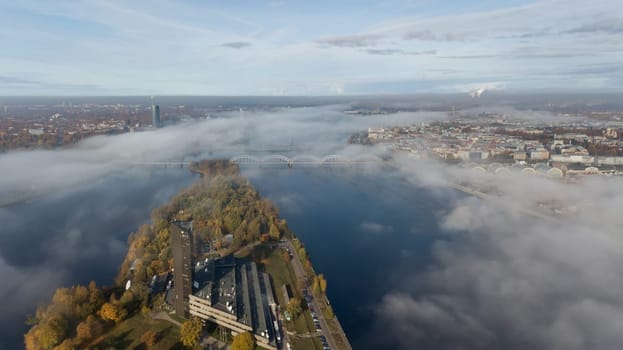 Riga Latvia Daugava river Zakusala island smoke cloud island Aerial drone top view