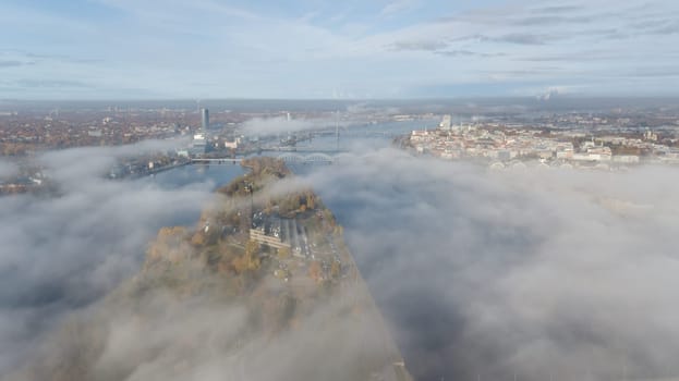 Riga Latvia Daugava river Zakusala island smoke cloud island Aerial drone top view