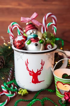 Rustic mug with colorful festive decorations for a merry christmas