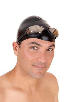 A portrait of a young handsome man shirtless wearing a cap and swim.goggle, smiling into the camera, isolated for white background.