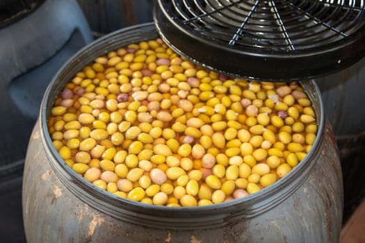 Olives factory. Olives in metal barrels in an interior plant for the production of olive oil on Cran Canaria. Concept of nature and healthy food.