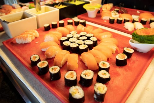 Buffett dinner. Foucus on Sushi  and fish specialties in buffett dinner at luxury hotel. Food concept.
