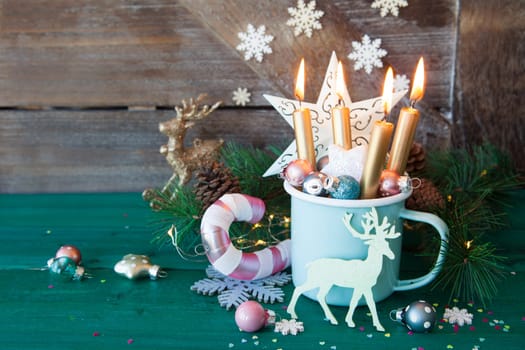 Rustic mug with colorful festive decorations for a merry christmas