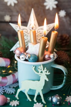 Rustic mug with colorful festive decorations for a merry christmas