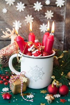 Rustic mug with colorful festive decorations for a merry christmas