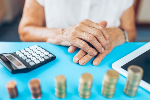 Senior woman at home checking her finances and invenstments