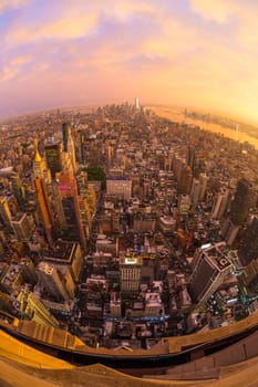 New York City skyline with Manhattan skyscrapers at dramatic vibrant after the storm sunset, USA. Rainbow and lightnings can be seen in background over Brooklyn bridge.