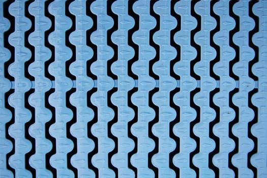 Closeup of blue plastic swimming overflow in a swimming pool. Swimming pool backgrounds.