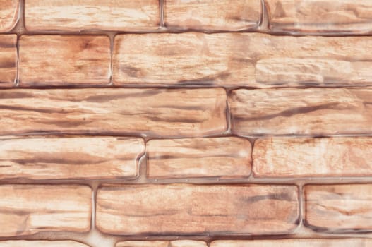 Background wall of large bricks of red close-up.
