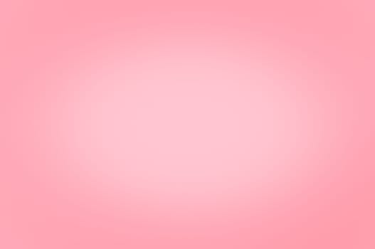 Blurred background of pink color. Enlightenment in the center. No texture.