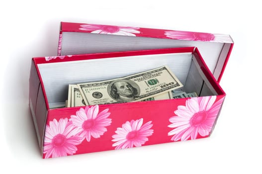 In the red box stacked in the form of a bundle of bills of one hundred US dollars.