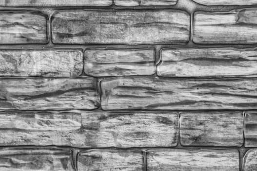 Wall of bricks close-up black and white.