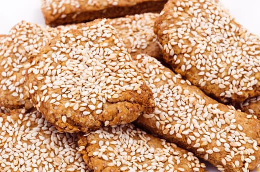 Fresh homemade cookies with sesame seeds close-up isolated.
