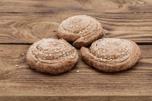 Biscuits with sesame on a wooden table