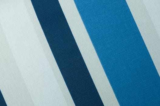 Textured with a pattern of diagonal strips of white and shades of blue