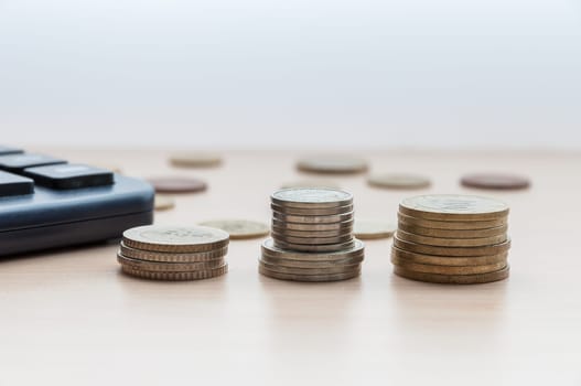 Coins in the columns on the table