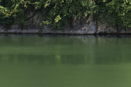 Lake with banks on the site of a former quarry for the extraction of limestone