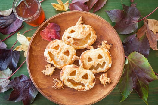 Scary puff pastry pumkpin pies for a Happy Halloween