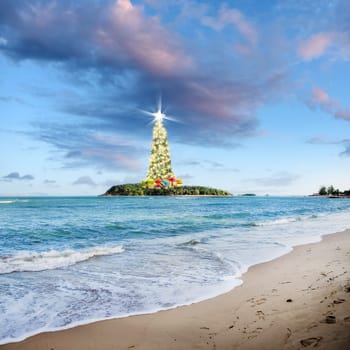 Conceptual image of Decorated Christmas tree on little tropical island over cloudy sky