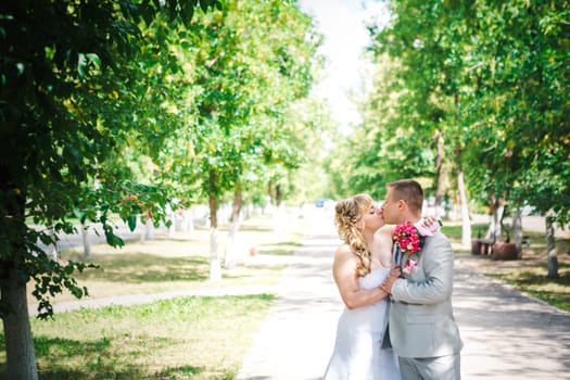 beautiful young couple stand on background forest