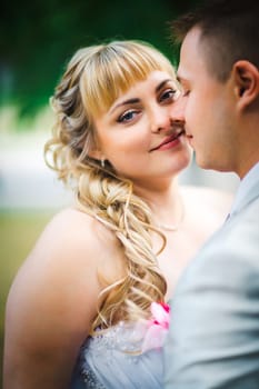 beautiful young couple stand on background forest