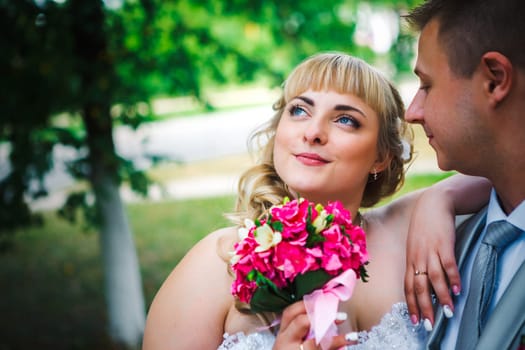 beautiful young couple stand on background forest