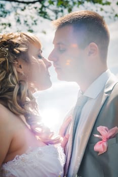 beautiful young couple stand on background forest