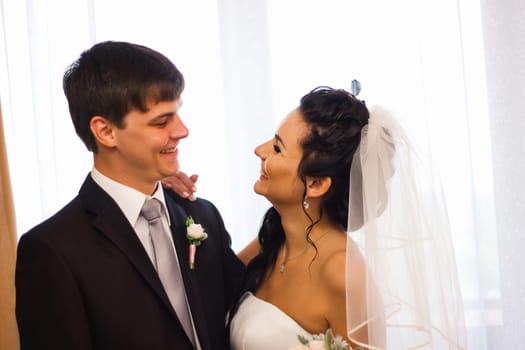 beautiful young couple stand on the balcony