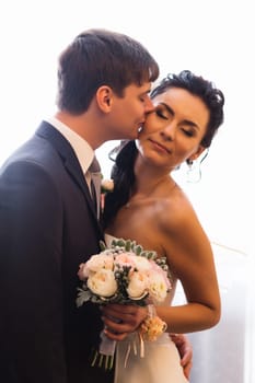 beautiful young couple stand on the balcony