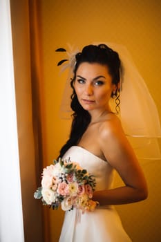beautiful young bride stand on background forest
