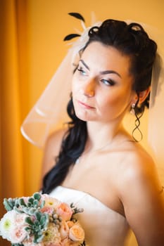 beautiful young bride stand on background forest