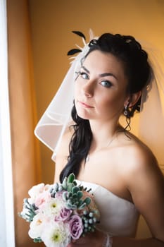 beautiful young bride stand on background forest