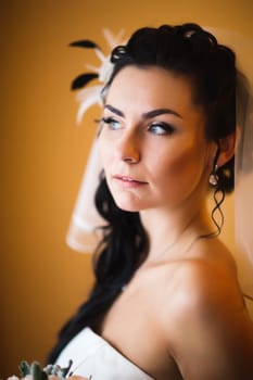 beautiful young bride stand on background forest