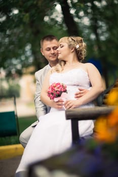 beautiful young couple stand on background forest