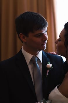 beautiful young couple stand on the balcony