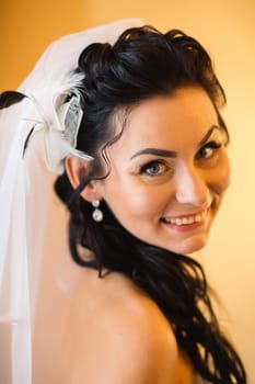 beautiful young bride stand on background forest